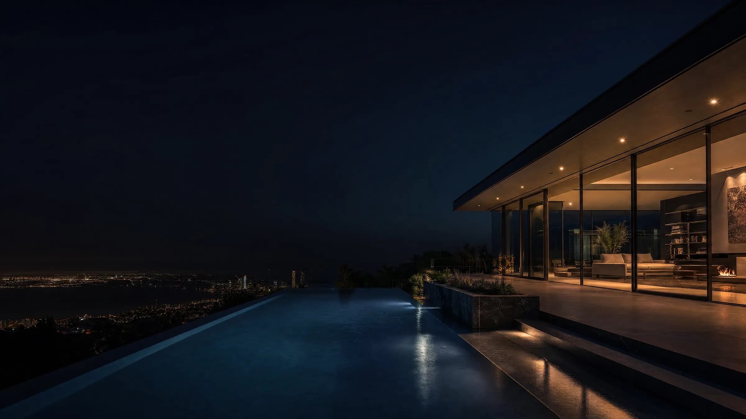 Modern glass residence and infinity pool at twilight